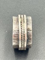 side view of hammered band showing spinner rings