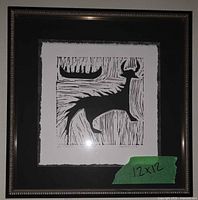 Frontal view of framed Mishipizhiw print showing imagery, mat and frame