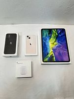 All four Apple product boxes laid out