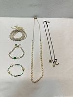 Overview of all five jewelry pieces laid out