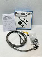 Full kit layout showing cable, keys, hardware bag, manual, box