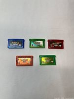 Front view of all five GBA Pokémon reproduction cartridges