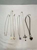 Overview of all six necklaces laid out