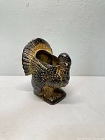 front view of brown ceramic turkey with open top
