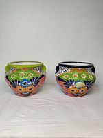 Both multicolor Talavera glazed pottery planters side by side