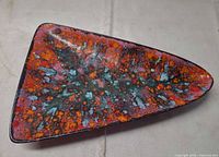 Top view showing triangular shape and vivid drip glaze pattern