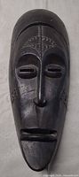 Full view of carved wood mask front