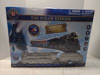 Front of box displaying locomotive, cars and track count