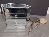 Full view of mirrored jewelry box, hand mirror and hair brush