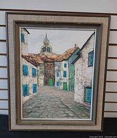 Full frontal view of framed painting