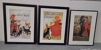 Three framed prints standing side-by-side