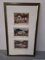 Front view showing entire framed triptych