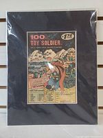 Front view of matted collage in sleeve