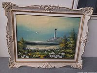 Full view of framed oil painting showing seascape and ornate gilt frame