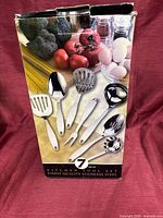 Front of boxed 7-piece stainless steel utensil set