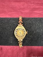 Front view of Bulova wristwatch showing case, dial and stretch bracelet