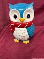 Front view of ceramic owl cookie jar showing overall design and colors