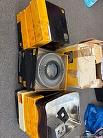 Stacked Kodak Carousel 140 slide trays, digital slide/negative scanner in metal tray