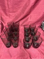 Group view of all 16 smoked gray glass tumblers (8 tall, 8 short)