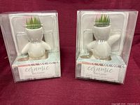 Two boxed white ceramic mini planters front view