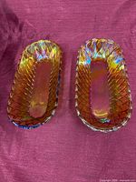 Pair of gold iridescent diamond-pattern glass vases, top view