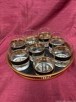 Tray with eight glasses arranged on top