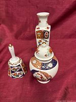 Front view of bell, vase and ginger jar