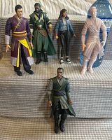 All five action figures standing upright for scale and condition overview