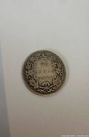 reverse side showing denomination, date, wreath design