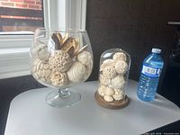 Overall view of both glass vessels with decorative balls