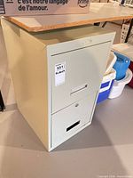 front and side view of beige metal 2-drawer filing cabinet