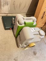 Dometic cassette toilet stacked on closed Coleman stove