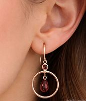 Earring worn in ear showing size and drop design