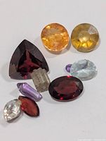 Group of nine assorted loose gemstones