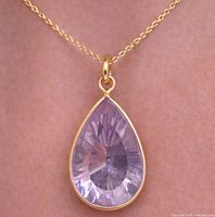 Pendant on chain against skin showing overall appearance