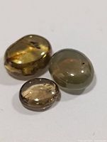 Three cat's eye gemstones close view