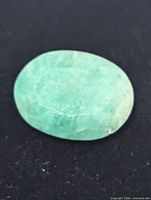 Close-up of the emerald showing color and inclusions