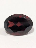 Front view of oval faceted garnet