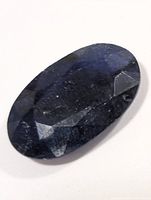 Front view of oval faceted blue sapphire