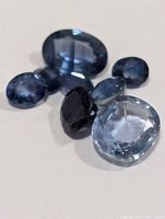 Seven loose blue sapphires assorted cuts