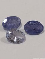 Close-up of three loose tanzanite stones