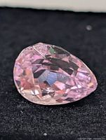 Close-up of kunzite gemstone showing color and facets