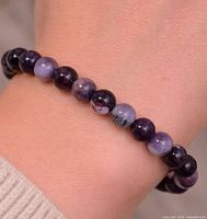 Bracelet worn on wrist showing bead color and size