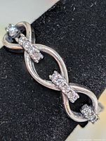 Front view of silver ring with CZ stones