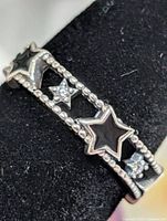 Close-up of star enamel and beaded edge detail