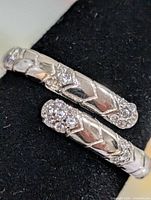 Close-up of both ends of the bypass ring showing CZ clusters and etched pattern