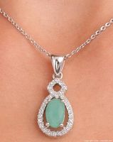 Necklace worn on model highlighting pendant and chain