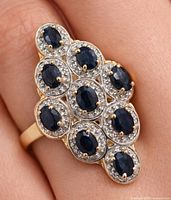 Ring on finger showing overall design and scale