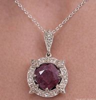 Full view of necklace worn, pendant design visible