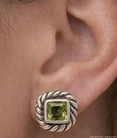 Earring worn to show scale and design